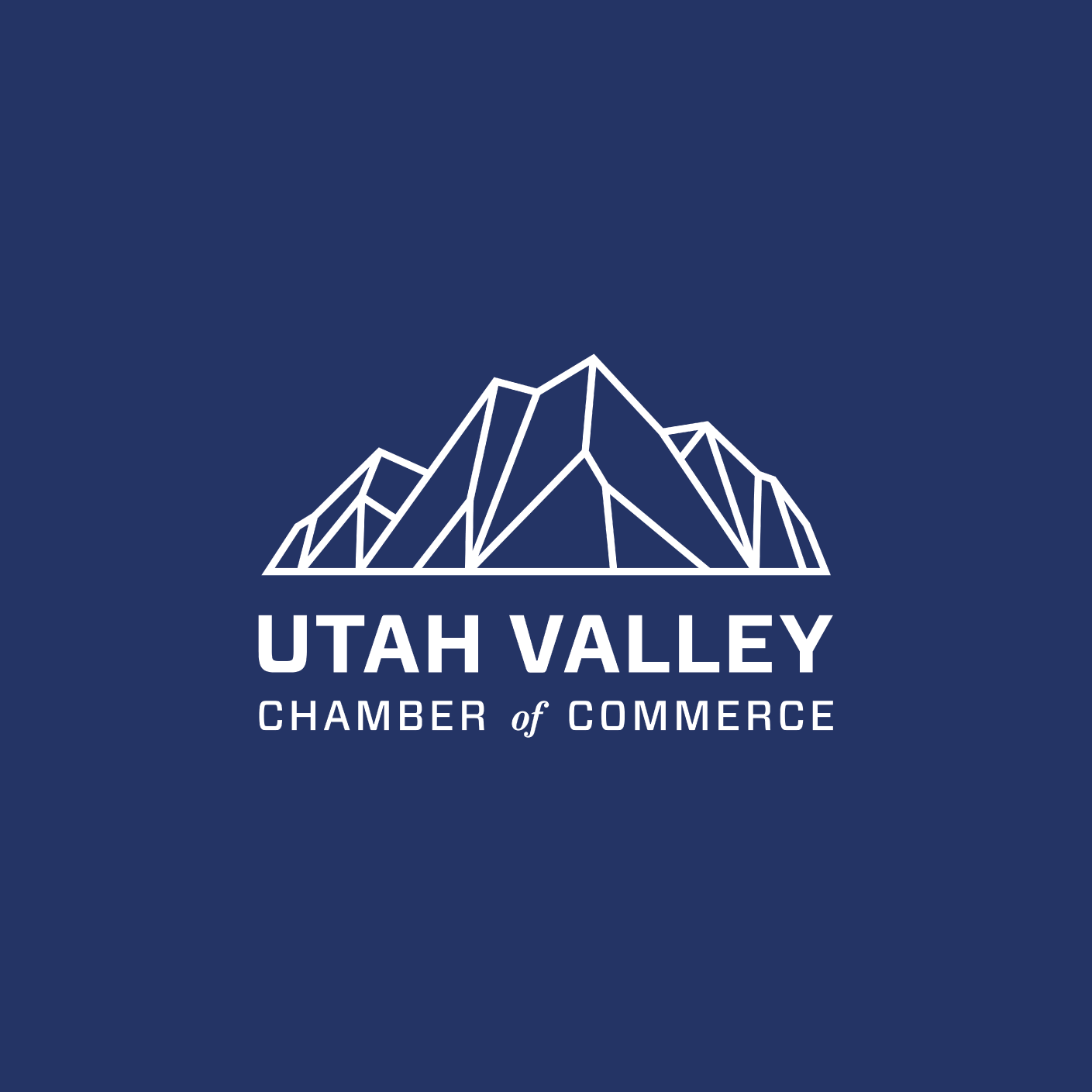 Logo of the Utah Valley Chamber of Commerce featuring stylized geometric mountain outlines above the organization’s name in white text on a navy blue background.