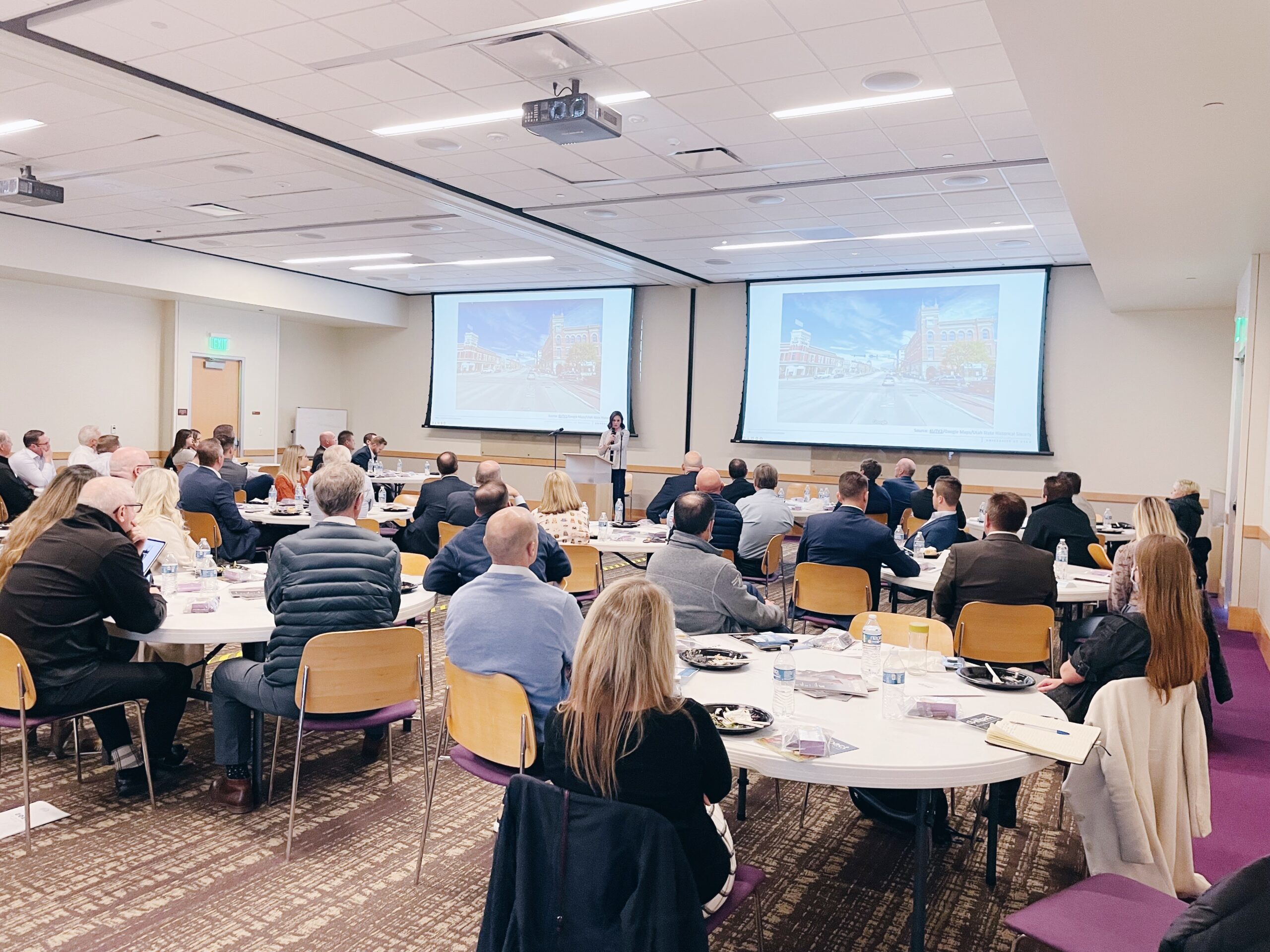 Business professionals attend a presentation at a Utah Valley Chamber of Commerce meeting.