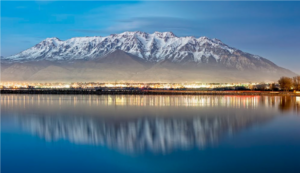 Utah Lake with Mount Timpanogos in the background at dusk